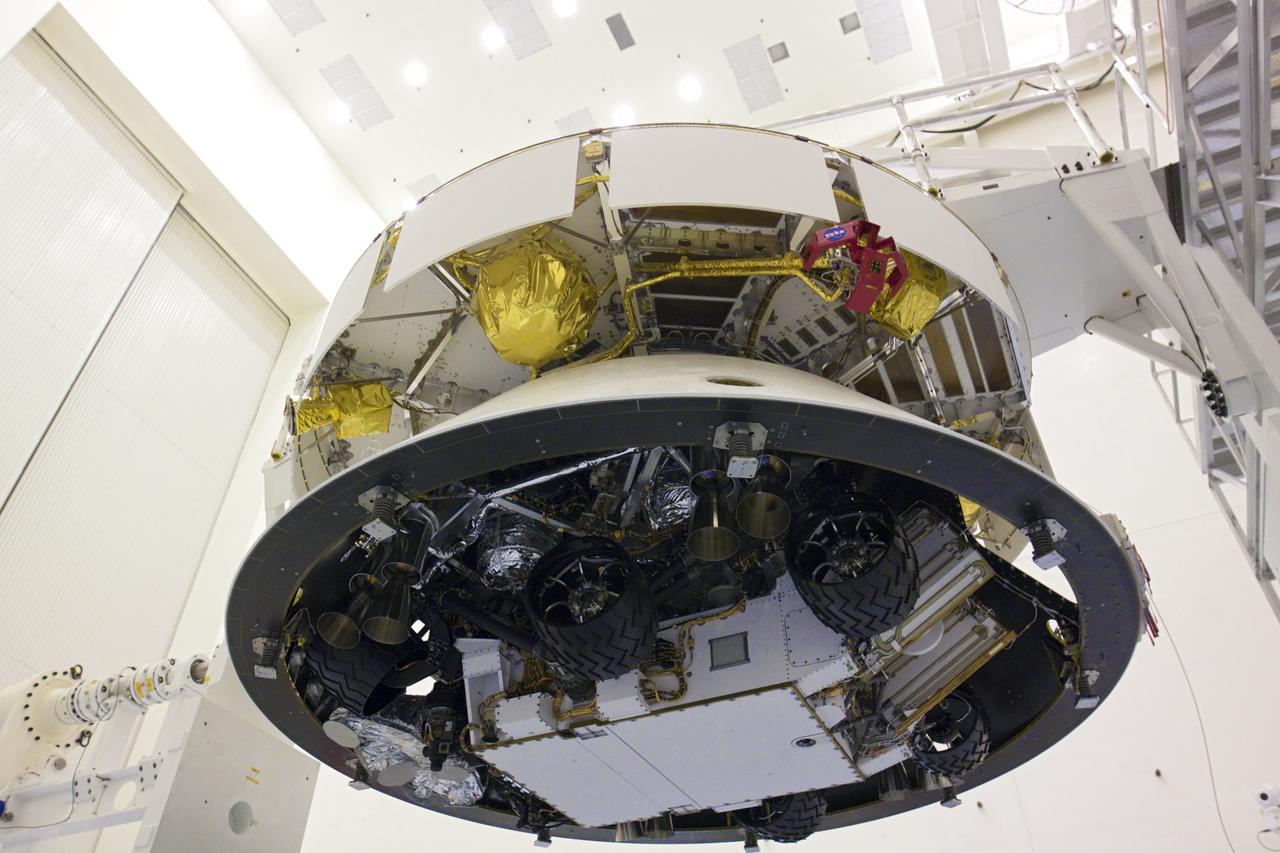 CAPE CANAVERAL, Fla. – In the Payload Hazardous Servicing Facility at NASA’s Kennedy Space Center in Florida, the camera captures a unique view of NASA's Mars Science Laboratory (MSL) mission aeroshell, (containing the compact car-sized rover Curiosity), which has been mated to the cruise stage. The cruise stage provides solar power, thrusters for navigation, and heat exchangers to the rover during its flight from Earth to Mars.   The rover Curiosity has 10 science instruments designed to search for evidence on whether Mars has had environments favorable to microbial life, including chemical ingredients for life.  The unique rover will use a laser to look inside rocks and release its gasses so that the rover’s spectrometer can analyze and send the data back to Earth. Launch of MSL aboard a United Launch Alliance Atlas V rocket is scheduled for Nov. 25 from Space Launch Complex 41 on Cape Canaveral Air Force Station in Florida. For more information, visit http:__www.nasa.gov_msl. Photo credit: NASA_Glenn Benson