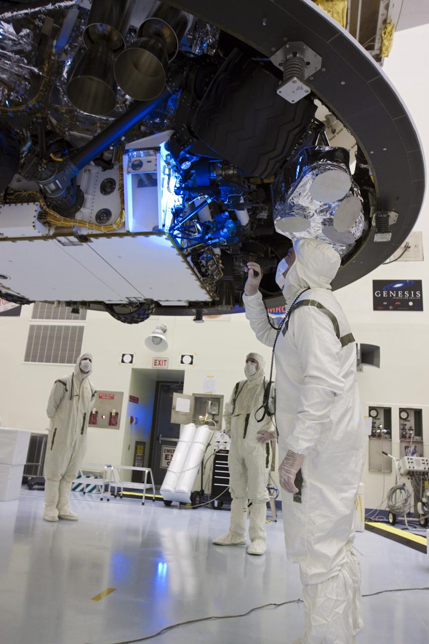 CAPE CANAVERAL, Fla. – In the Payload Hazardous Servicing Facility at NASA’s Kennedy Space Center in Florida, a technician inspects beneath NASA's Mars Science Laboratory (MSL) mission aeroshell, (containing the compact car-sized rover Curiosity), which has been mated to the cruise stage. The cruise stage provides solar power, thrusters for navigation, and heat exchangers to the rover during its flight from Earth to Mars.   The rover Curiosity has 10 science instruments designed to search for evidence on whether Mars has had environments favorable to microbial life, including chemical ingredients for life.  The unique rover will use a laser to look inside rocks and release its gasses so that the rover’s spectrometer can analyze and send the data back to Earth. Launch of MSL aboard a United Launch Alliance Atlas V rocket is scheduled for Nov. 25 from Space Launch Complex 41 on Cape Canaveral Air Force Station in Florida. For more information, visit http:__www.nasa.gov_msl. Photo credit: NASA_Glenn Benson