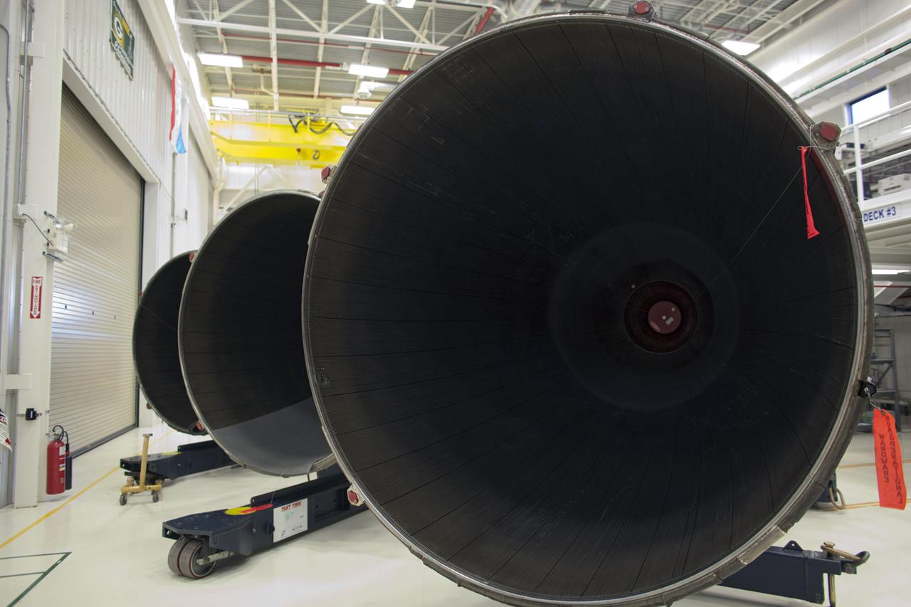 CAPE CANAVERAL, Fla. – At NASA’s Kennedy Space Center in Florida, the large engine bells of several Pratt Whitney Rocketdyne space shuttle main engines (SSMEs) are lined up inside the Engine Shop. For the first time, all 15 main engines are in the Engine Shop at the same time. They are being prepared for shipment to NASA's Stennis Space Center in Mississippi for storage following the completion of the Space Shuttle Program. The engines are being repurposed for use on NASA’s Space Launch System heavy lift rocket. Photo credit: NASA_Dimitri Gerondidakis