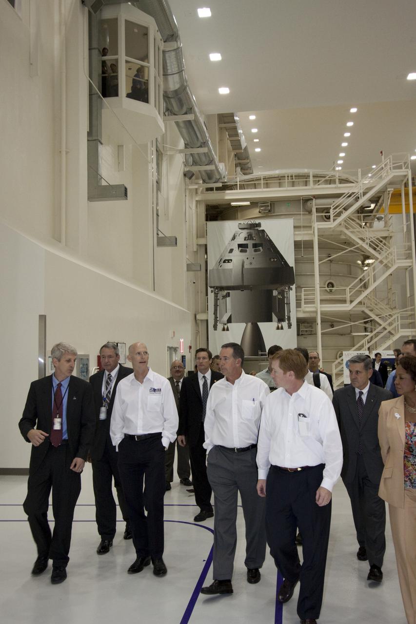 CAPE CANAVERAL, Fla. – In the Operations and Checkout Building at NASA's Kennedy Space Center in Florida, NASA’s Orion Production Manager Scott Wilson, (from left), briefs Florida Gov. Rick Scott on the processing of the Orion Multi-Purpose Crew Vehicle. Also touring are Jeff Atwater, Florida chief financial officer, Adam Putnam, Florida agriculture commissioner, Robert Cabana, Kennedy Space Center director, and Florida Lt. Gov. Jennifer Carroll, chairwoman of Space Florida.  The governor and other state officials were at Kennedy for a Florida cabinet meeting and a space industry roundtable at the Kennedy Space Center Visitor Complex’s Debus Conference Center. They also toured selected facilities around the center. Photo credit: NASA_Jim Grossmann