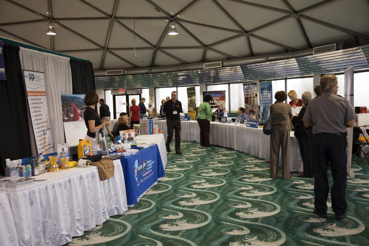 CAPE CANAVERAL, Fla. – Business leaders visit exhibitor booths at the annual Business Opportunities Expo 2011, in Cruise Terminal 4 at Port Canaveral in Florida. The trade show is sponsored by NASA Kennedy Space Center’s Prime Contractor Board, the 45th Space Wing and Canaveral Port Authority.  The event is free and open to the public. It features about 175 business and government exhibitors from across the nation and Brevard County and is geared toward business leaders who are interested in learning more about government contracting and what local and national vendors have to offer.  Photo credit: NASA_Gianni Woods