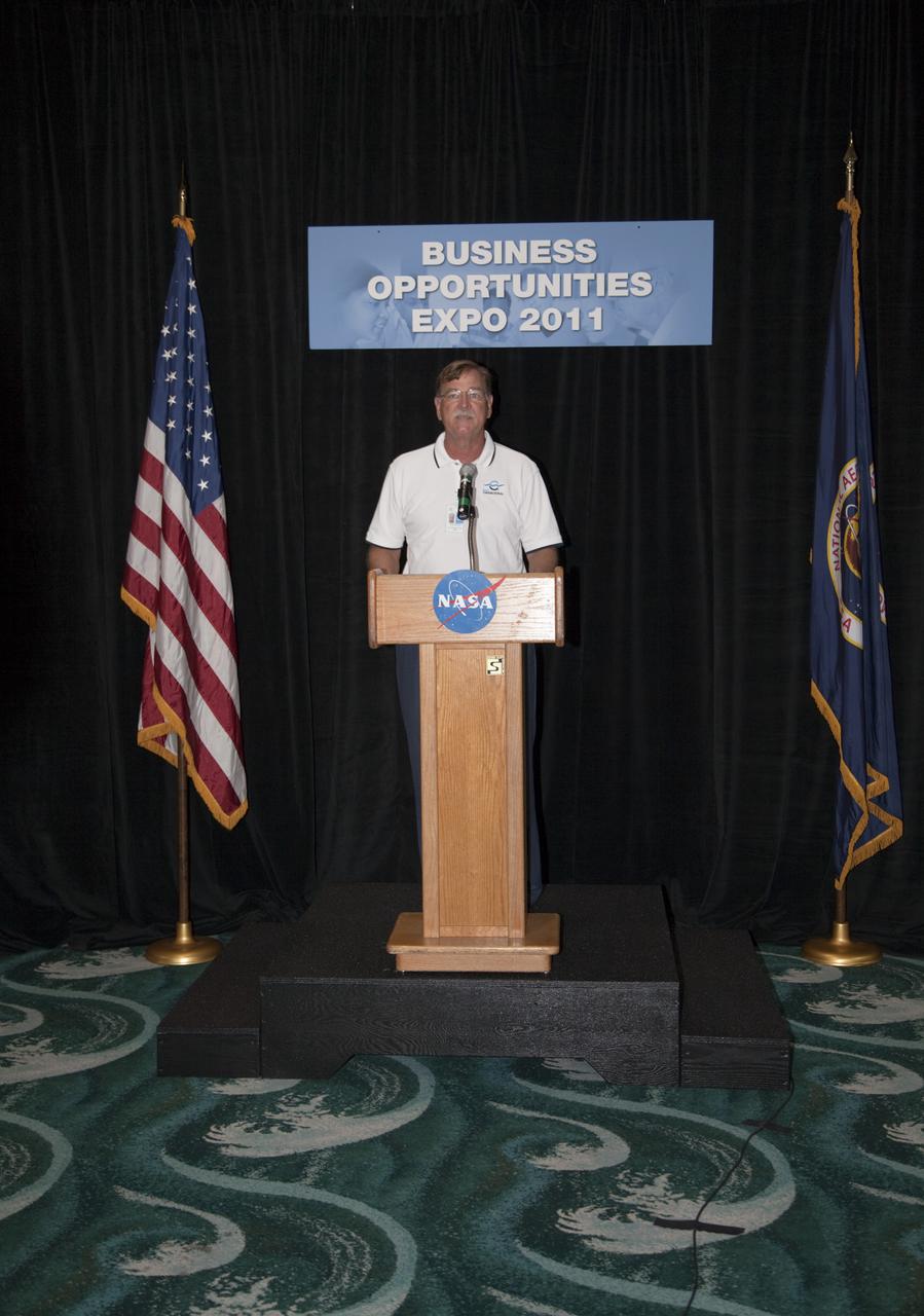 CAPE CANAVERAL, Fla. – Canaveral Port Authority Commissioner Tom Weinberg welcomes business leaders and other attendees to the annual Business Opportunities Expo 2011, in Cruise Terminal 4 at Port Canaveral in Florida. The trade show is sponsored by NASA Kennedy Space Center’s Prime Contractor Board, the 45th Space Wing and Canaveral Port Authority.  The event is free and open to the public. It features about 175 business and government exhibitors from across the nation and Brevard County and is geared toward business leaders who are interested in learning more about government contracting and what local and national vendors have to offer.  Photo credit: NASA_Gianni Woods