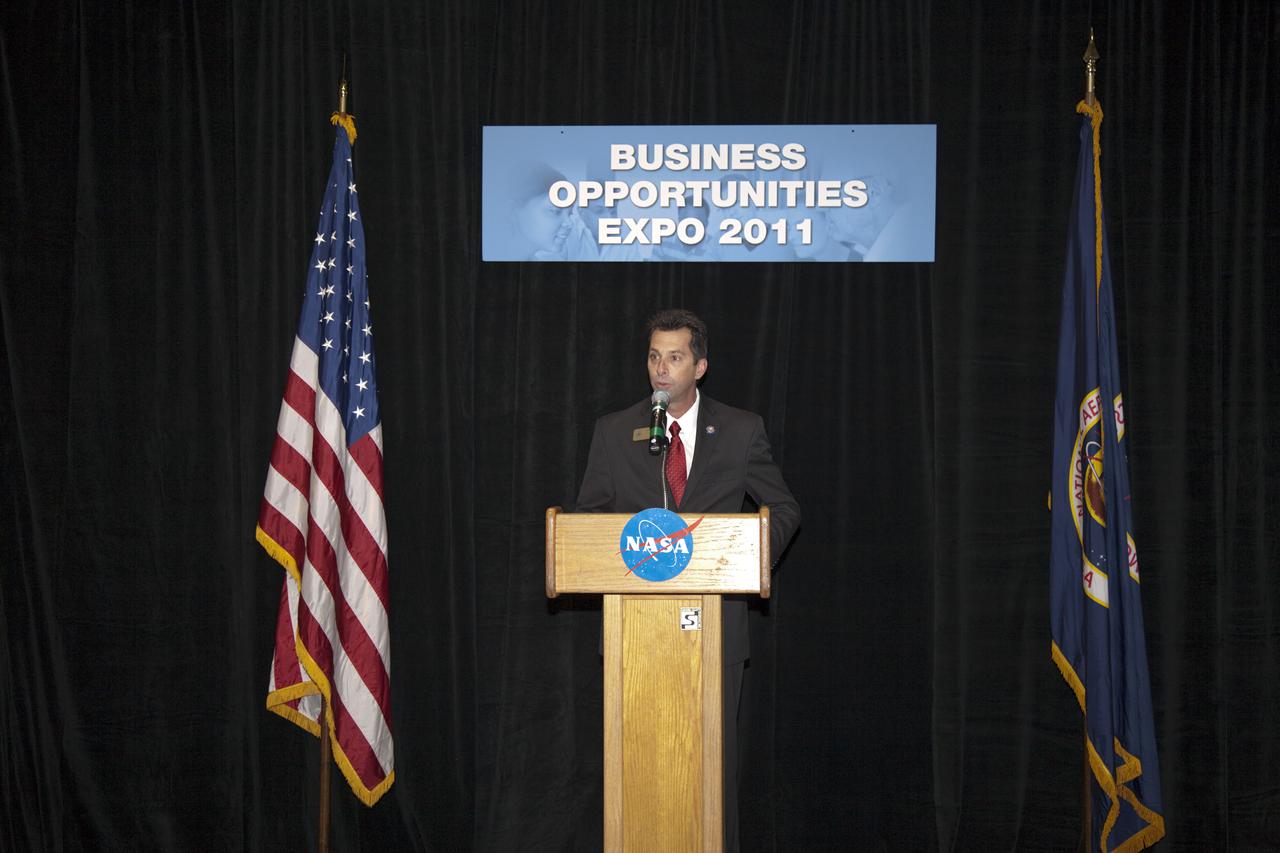 CAPE CANAVERAL, Fla. – Patrick D. Gavin, the director of community relations for Rep. Bill Posey, welcomes business leaders and other attendees to the annual Business Opportunities Expo 2011, in Cruise Terminal 4 at Port Canaveral in Florida. The trade show is sponsored by NASA Kennedy Space Center’s Prime Contractor Board, the 45th Space Wing and Canaveral Port Authority.  The event is free and open to the public. It features about 175 business and government exhibitors from across the nation and Brevard County and is geared toward business leaders who are interested in learning more about government contracting and what local and national vendors have to offer.  Photo credit: NASA_Gianni Woods