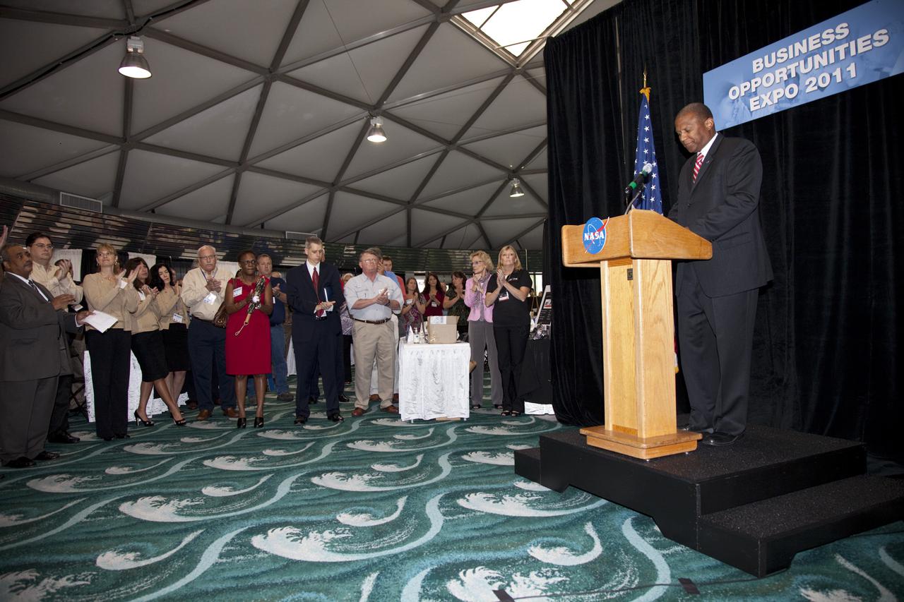CAPE CANAVERAL, Fla. – Kelvin Manning, associate director for Business Operations at NASA’s Kennedy Space Center in Florida, welcomes business leaders and other attendees to the annual Business Opportunities Expo 2011, in Cruise Terminal 4 at Port Canaveral in Florida. The trade show is sponsored by NASA Kennedy Space Center’s Prime Contractor Board, the 45th Space Wing and Canaveral Port Authority.  The event is free and open to the public. It features about 175 business and government exhibitors from across the nation and Brevard County and is geared toward business leaders who are interested in learning more about government contracting and what local and national vendors have to offer.  Photo credit: NASA_Gianni Woods