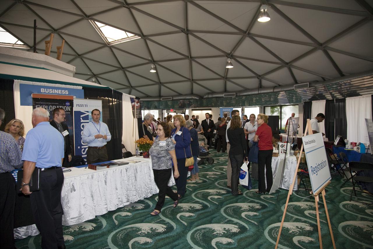 CAPE CANAVERAL, Fla. – Business leaders visit exhibitor booths at the annual Business Opportunities Expo 2011, in Cruise Terminal 4 at Port Canaveral in Florida. The trade show is sponsored by NASA Kennedy Space Center’s Prime Contractor Board, the 45th Space Wing and Canaveral Port Authority.  The event is free and open to the public. It features about 175 business and government exhibitors from across the nation and Brevard County and is geared toward business leaders who are interested in learning more about government contracting and what local and national vendors have to offer.  Photo credit: NASA_Gianni Woods