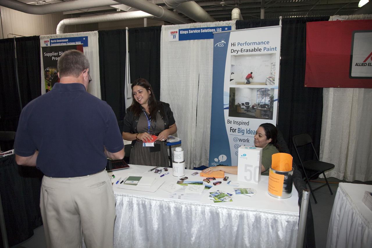 CAPE CANAVERAL, Fla. – A business leader visits an exhibitor booth at the annual Business Opportunities Expo 2011, in Cruise Terminal 4 at Port Canaveral in Florida. The trade show is sponsored by NASA Kennedy Space Center’s Prime Contractor Board, the 45th Space Wing and Canaveral Port Authority.  The event is free and open to the public. It features about 175 business and government exhibitors from across the nation and Brevard County and is geared toward business leaders who are interested in learning more about government contracting and what local and national vendors have to offer.  Photo credit: NASA_Gianni Woods