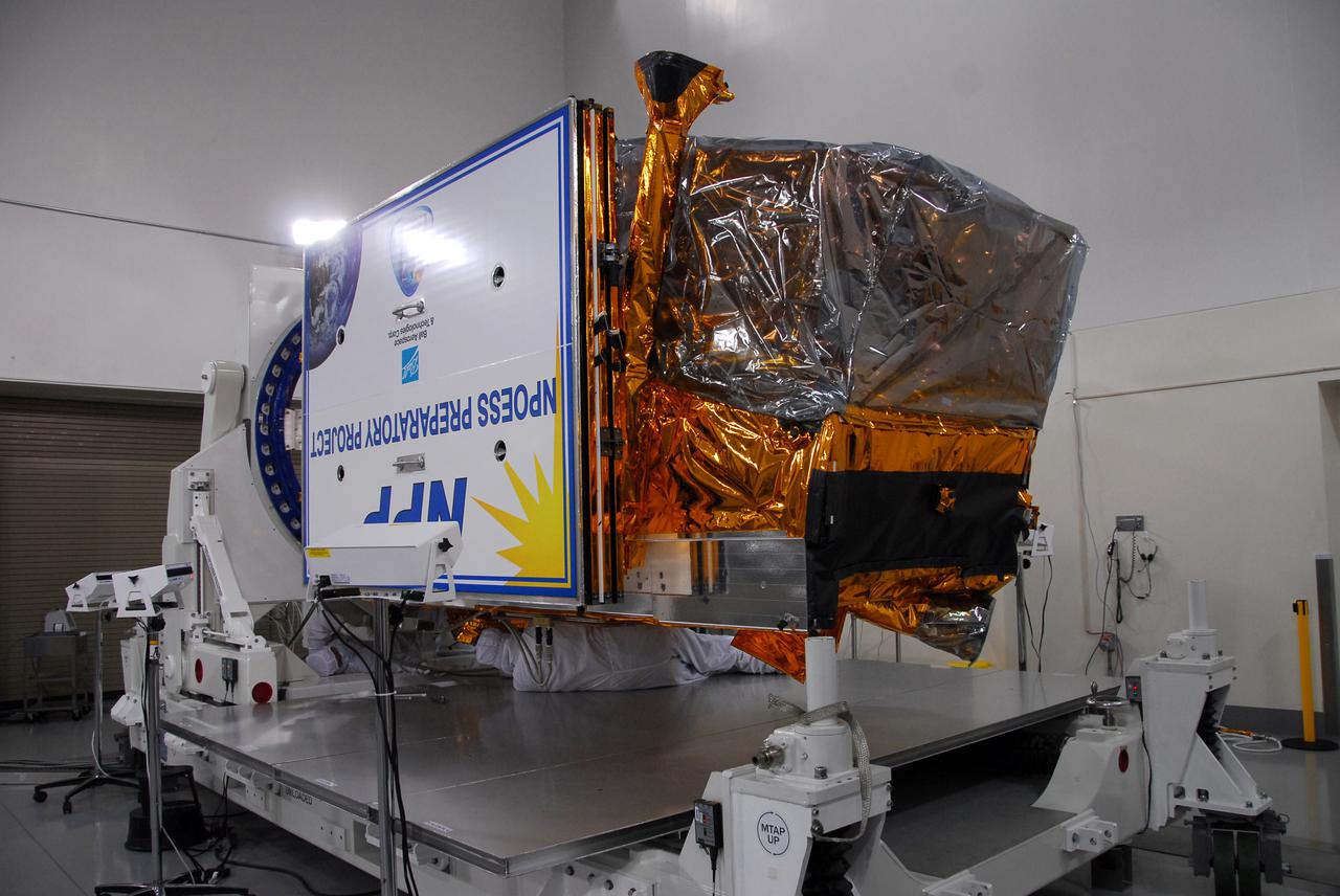 In a clean room inside the Astrotech Payload Processing Facility at Vandenberg Air Force Base in California, NASA’s National Polar-orbiting Operational Environmental Satellite System Preparatory Project (NPP) is ready for testing.    NPP represents a critical first step in building the next-generation of Earth-observing satellites. NPP will carry the first of the new sensors developed for this satellite fleet, now known as the Joint Polar Satellite System (JPSS), to be launched in 2016. NPP is the bridge between NASA's Earth Observing System (EOS) satellites and the forthcoming series of JPSS satellites. The mission will test key technologies and instruments for the JPSS missions. NPP is targeted to launch Oct. 28 from Space Launch Complex-2 aboard a United Launch Alliance Delta II rocket. For more information, visit http:__www.nasa.gov_NPP.  Photo credit: NASA_Aaron Taubman, 30th Communications Squadron, VAFB