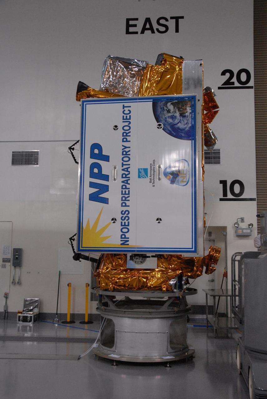 In a clean room inside the Astrotech Payload Processing Facility at Vandenberg Air Force Base in California, Ball Aerospace NASA’s National Polar-orbiting Operational Environmental Satellite System Preparatory Project (NPP) spacecraft has been attached to a payload adapter.  NPP represents a critical first step in building the next-generation of Earth-observing satellites. NPP will carry the first of the new sensors developed for this satellite fleet, now known as the Joint Polar Satellite System (JPSS), to be launched in 2016. NPP is the bridge between NASA's Earth Observing System (EOS) satellites and the forthcoming series of JPSS satellites. The mission will test key technologies and instruments for the JPSS missions. NPP is targeted to launch Oct. 28 from Space Launch Complex-2 aboard a United Launch Alliance Delta II rocket. For more information, visit http:__www.nasa.gov_NPP.  Photo credit: NASA_Roy Allison, VAFB