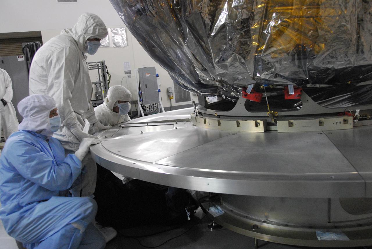 In a clean room inside the Astrotech Payload Processing Facility at Vandenberg Air Force Base in California, Ball Aerospace technicians NASA’s National Polar-orbiting Operational Environmental Satellite System Preparatory Project (NPP) spacecraft for its move to the launch pad. NPP represents a critical first step in building the next-generation of Earth-observing satellites. NPP will carry the first of the new sensors developed for this satellite fleet, now known as the Joint Polar Satellite System (JPSS), to be launched in 2016. NPP is the bridge between NASA's Earth Observing System (EOS) satellites and the forthcoming series of JPSS satellites. The mission will test key technologies and instruments for the JPSS missions. NPP is targeted to launch Oct. 28 from Space Launch Complex-2 aboard a United Launch Alliance Delta II rocket. For more information, visit http:__www.nasa.gov_NPP. Photo credit: NASA_VAFB