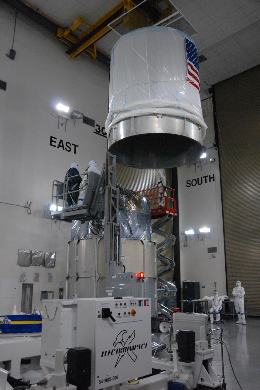 In a clean room inside the Astrotech Payload Processing Facility at Vandenberg Air Force Base in California, Ball Aerospace technicians install NASA’s National Polar-orbiting Operational Environmental Satellite System Preparatory Project (NPP) spacecraft in a payload transportation canister for its trip to the launch pad.     NPP represents a critical first step in building the next-generation of Earth-observing satellites. NPP will carry the first of the new sensors developed for this satellite fleet, now known as the Joint Polar Satellite System (JPSS), to be launched in 2016. NPP is the bridge between NASA's Earth Observing System (EOS) satellites and the forthcoming series of JPSS satellites. The mission will test key technologies and instruments for the JPSS missions. NPP is targeted to launch Oct. 28 from Space Launch Complex-2 aboard a United Launch Alliance Delta II rocket. For more information, visit http:__www.nasa.gov_NPP.  Photo credit: NASA_Roy Allison, VAFB