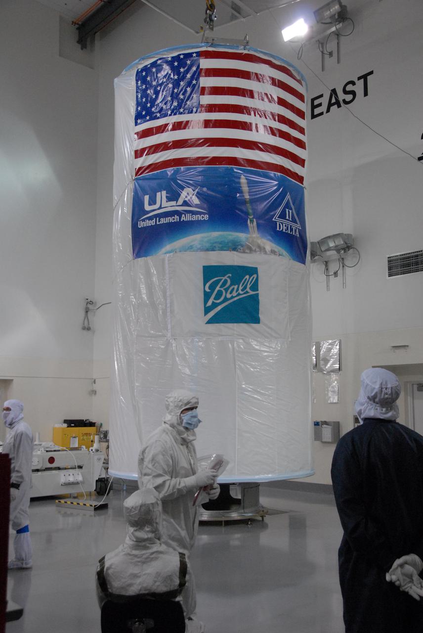In a clean room inside the Astrotech Payload Processing Facility at Vandenberg Air Force Base in California, Ball Aerospace technicians have completed the installation of NASA’s National Polar-orbiting Operational Environmental Satellite System Preparatory Project (NPP) spacecraft in a payload transportation canister in preparation for its trip to the launch pad.   NPP represents a critical first step in building the next-generation of Earth-observing satellites. NPP will carry the first of the new sensors developed for this satellite fleet, now known as the Joint Polar Satellite System (JPSS), to be launched in 2016. NPP is the bridge between NASA's Earth Observing System (EOS) satellites and the forthcoming series of JPSS satellites. The mission will test key technologies and instruments for the JPSS missions. NPP is targeted to launch Oct. 28 from Space Launch Complex-2 aboard a United Launch Alliance Delta II rocket. For more information, visit http:__www.nasa.gov_NPP.  Photo credit: NASA_Roy Allison, VAFB