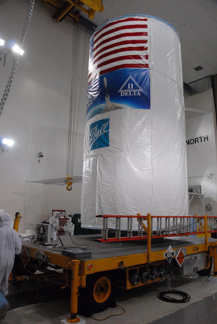 In a clean room inside the Astrotech Payload Processing Facility at Vandenberg Air Force Base in California, NASA’s National Polar-orbiting Operational Environmental Satellite System Preparatory Project (NPP) spacecraft is ready for transfer to the launch pad inside a payload transportation canister.  NPP represents a critical first step in building the next-generation of Earth-observing satellites. NPP will carry the first of the new sensors developed for this satellite fleet, now known as the Joint Polar Satellite System (JPSS), to be launched in 2016. NPP is the bridge between NASA's Earth Observing System (EOS) satellites and the forthcoming series of JPSS satellites. The mission will test key technologies and instruments for the JPSS missions. NPP is targeted to launch Oct. 28 from Space Launch Complex-2 aboard a United Launch Alliance Delta II rocket. For more information, visit http:__www.nasa.gov_NPP.  Photo credit: NASA_Roy Allison, VAFB