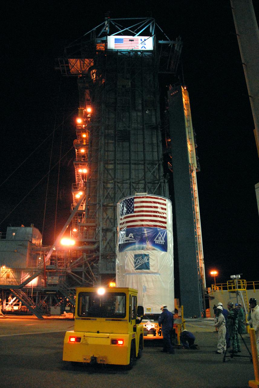 Tucked inside a protective payload transportation canister, NASA’s National Polar-orbiting Operational Environmental Satellite System Preparatory Project (NPP) spacecraft arrives at Vandenberg Air Force Base's Space Launch Complex-2. NPP represents a critical first step in building the next-generation of Earth-observing satellites. NPP will carry the first of the new sensors developed for this satellite fleet, now known as the Joint Polar Satellite System (JPSS), to be launched in 2016. NPP is the bridge between NASA's Earth Observing System (EOS) satellites and the forthcoming series of JPSS satellites. The mission will test key technologies and instruments for the JPSS missions. NPP is targeted to launch Oct. 28 from Space Launch Complex-2 aboard a United Launch Alliance Delta II rocket. For more information, visit http:__www.nasa.gov_NPP. Photo credit: NASA_Mark P. Mackley, VAFB
