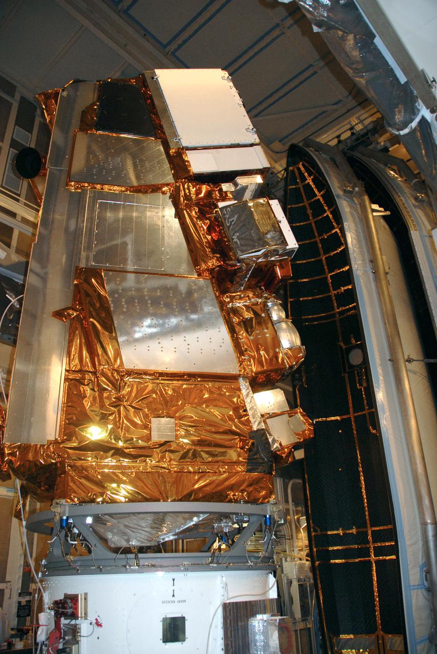 VANDENBERG AIR FORCE BASE, Calif. – At Vandenberg Air Force Base's Space Launch Complex-2 in California, preparations are under way to enclose NASA’s National Polar-orbiting Operational Environmental Satellite System Preparatory Project (NPP) spacecraft into the clamshell-shaped Delta payload fairing. The fairing will protect the spacecraft from the impact of aerodynamic pressure and heating during ascent and will be jettisoned once the spacecraft is outside the Earth's atmosphere.  NPP represents a critical first step in building the next-generation of Earth-observing satellites. NPP will carry the first of the new sensors developed for this satellite fleet, now known as the Joint Polar Satellite System (JPSS) to be launched in 2016. NPP is the bridge between NASA's Earth Observing System (EOS) satellites and the forthcoming series of JPSS satellites. The mission will test key technologies and instruments for the JPSS missions. NPP is targeted to launch Oct. 28 from Space Launch Complex-2 aboard a United Launch Alliance Delta II rocket. For more information, visit http:__www.nasa.gov_NPP. Photo credit: NASA_Mark P. Mackley, VAFB