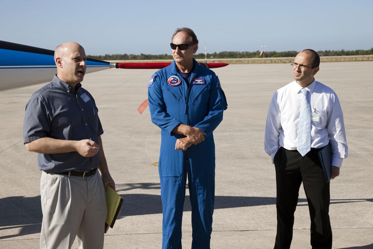 CAPE CANAVERAL, Fla. – Before a high speed taxi test using a Starfighters, Inc. F-104, from left, Mark Homnick, CEO of 4Frontiers Corporation, Rick Svetkoff, Starfighters, Inc. president and pilot, and Panayot Slavov, business development manager for 4Frontiers Corporation, address guests at the Shuttle Landing Facility (SLF) at NASA’s Kennedy Space Center in Florida.   4Frontiers is testing the Star Lab suborbital launch vehicle which has the potential to carry payloads into low earth orbit. Tests are being conducted to verify the aeronautical conditions of the Star Lab suborbital launch vehicle. This is the first of eight tests the launch vehicle will undergo. 4Frontiers Corporation is aiming for testing to be completed by early 2012, with commercial flights starting mid-2012. Starfighters, Inc. has signed a Space Act Agreement with NASA for the use of the SLF facilities at Kennedy Space Center. Photo credit: NASA_Gianni M. Woods
