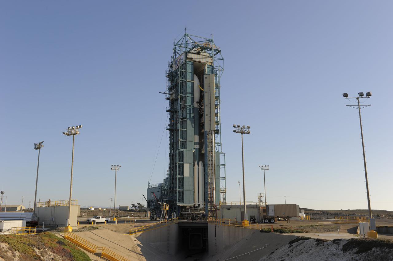 VANDENBERG AIR FORCE BASE, Calif. – At Vandenberg Air Force Base's Space Launch Complex-2 in California, the mobile service tower begins to roll back from around a United Launch Alliance Delta II rocket with the National Polar-orbiting Operational Environmental Satellite System Preparatory Project (NPP) spacecraft aboard. NPP represents a critical first step in building the next-generation of Earth-observing satellites. NPP will carry the first of the new sensors developed for this satellite fleet, now known as the Joint Polar Satellite System (JPSS) to be launched in 2016. NPP is the bridge between NASA's Earth Observing System (EOS) satellites and the forthcoming series of JPSS satellites. The mission will test key technologies and instruments for the JPSS missions. For more information, visit http:__www.nasa.gov_NPP. Photo credit: NASA_Kim Shiflett