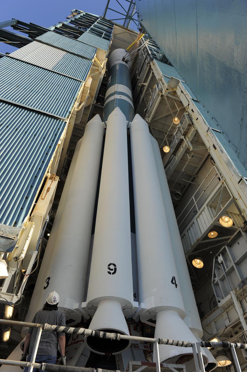 VANDENBERG AIR FORCE BASE, Calif. – At Vandenberg Air Force Base's Space Launch Complex-2 in California, the mobile service tower begins to roll back from around a United Launch Alliance Delta II rocket with the National Polar-orbiting Operational Environmental Satellite System Preparatory Project (NPP) spacecraft aboard. NPP represents a critical first step in building the next-generation of Earth-observing satellites. NPP will carry the first of the new sensors developed for this satellite fleet, now known as the Joint Polar Satellite System (JPSS) to be launched in 2016. NPP is the bridge between NASA's Earth Observing System (EOS) satellites and the forthcoming series of JPSS satellites. The mission will test key technologies and instruments for the JPSS missions. For more information, visit http:__www.nasa.gov_NPP. Photo credit: NASA_Kim Shiflett