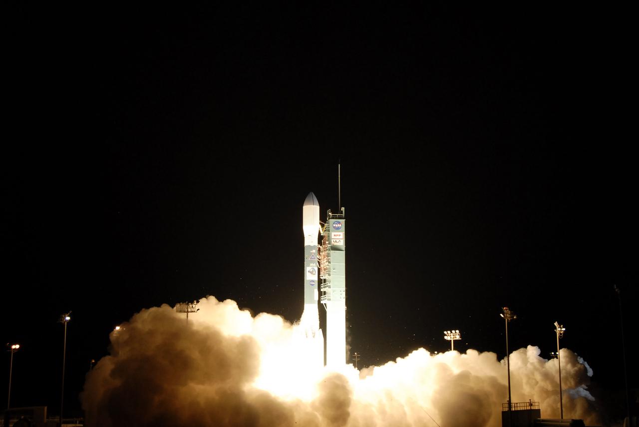 VANDENBERG AIR FORCE BASE, Calif. -- At Space Launch Complex-2 on Vandenberg Air Force Base in California, an exhaust cloud forms around the United Launch Alliance Delta II rocket carrying NASA's National Polar-orbiting Operational Environmental Satellite System Preparatory Project (NPP) into space. Liftoff was at 2:48 a.m. PDT.  NPP represents a critical first step in building the next-generation of Earth-observing satellites. NPP will carry the first of the new sensors developed for this satellite fleet, now known as the Joint Polar Satellite System (JPSS) to be launched in 2016. NPP is the bridge between NASA's Earth Observing System (EOS) satellites and the forthcoming series of JPSS satellites. The mission will test key technologies and instruments for the JPSS missions. For more information, visit http:__www.nasa.gov_NPP. Photo credit: NASA_Kim Shiflett
