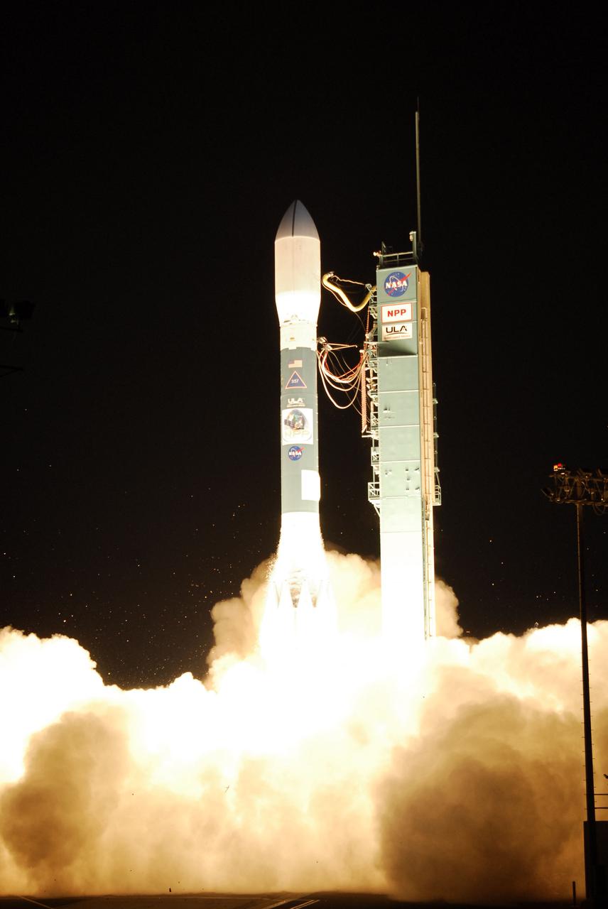 VANDENBERG AIR FORCE BASE, Calif. -- At Space Launch Complex-2 on Vandenberg Air Force Base in California, the United Launch Alliance Delta II rocket carrying NASA's National Polar-orbiting Operational Environmental Satellite System Preparatory Project (NPP) is illuminated by the brilliance of its engines' ignition. Liftoff was at 2:48 a.m. PDT.  NPP represents a critical first step in building the next-generation of Earth-observing satellites. NPP will carry the first of the new sensors developed for this satellite fleet, now known as the Joint Polar Satellite System (JPSS) to be launched in 2016. NPP is the bridge between NASA's Earth Observing System (EOS) satellites and the forthcoming series of JPSS satellites. The mission will test key technologies and instruments for the JPSS missions. For more information, visit http:__www.nasa.gov_NPP. Photo credit: NASA_Kim Shiflett