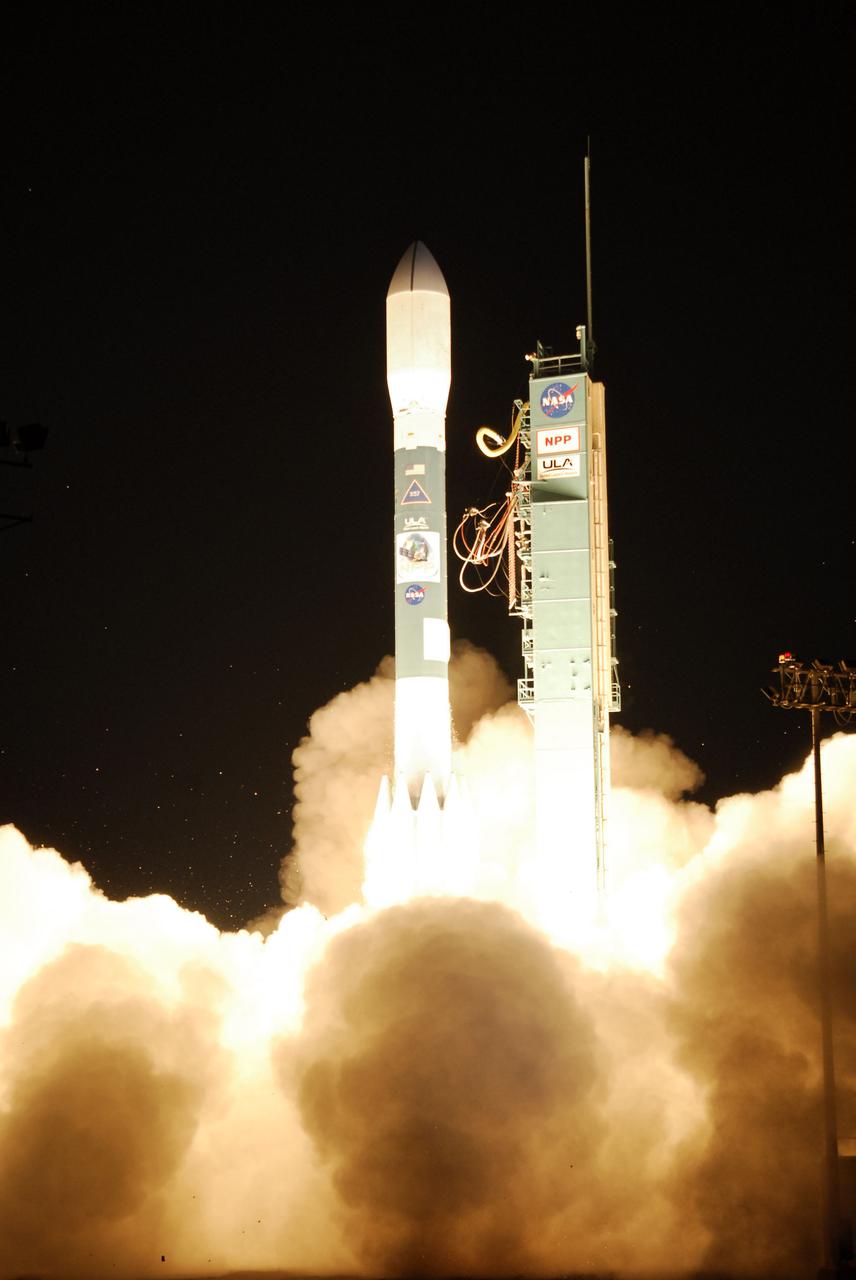 VANDENBERG AIR FORCE BASE, Calif. -- At Space Launch Complex-2 on Vandenberg Air Force Base in California, an exhaust cloud builds around the United Launch Alliance Delta II rocket carrying NASA's National Polar-orbiting Operational Environmental Satellite System Preparatory Project (NPP) into space. Liftoff was at 2:48 a.m. PDT.  NPP represents a critical first step in building the next-generation of Earth-observing satellites. NPP will carry the first of the new sensors developed for this satellite fleet, now known as the Joint Polar Satellite System (JPSS) to be launched in 2016. NPP is the bridge between NASA's Earth Observing System (EOS) satellites and the forthcoming series of JPSS satellites. The mission will test key technologies and instruments for the JPSS missions. For more information, visit http:__www.nasa.gov_NPP. Photo credit: NASA_Kim Shiflett