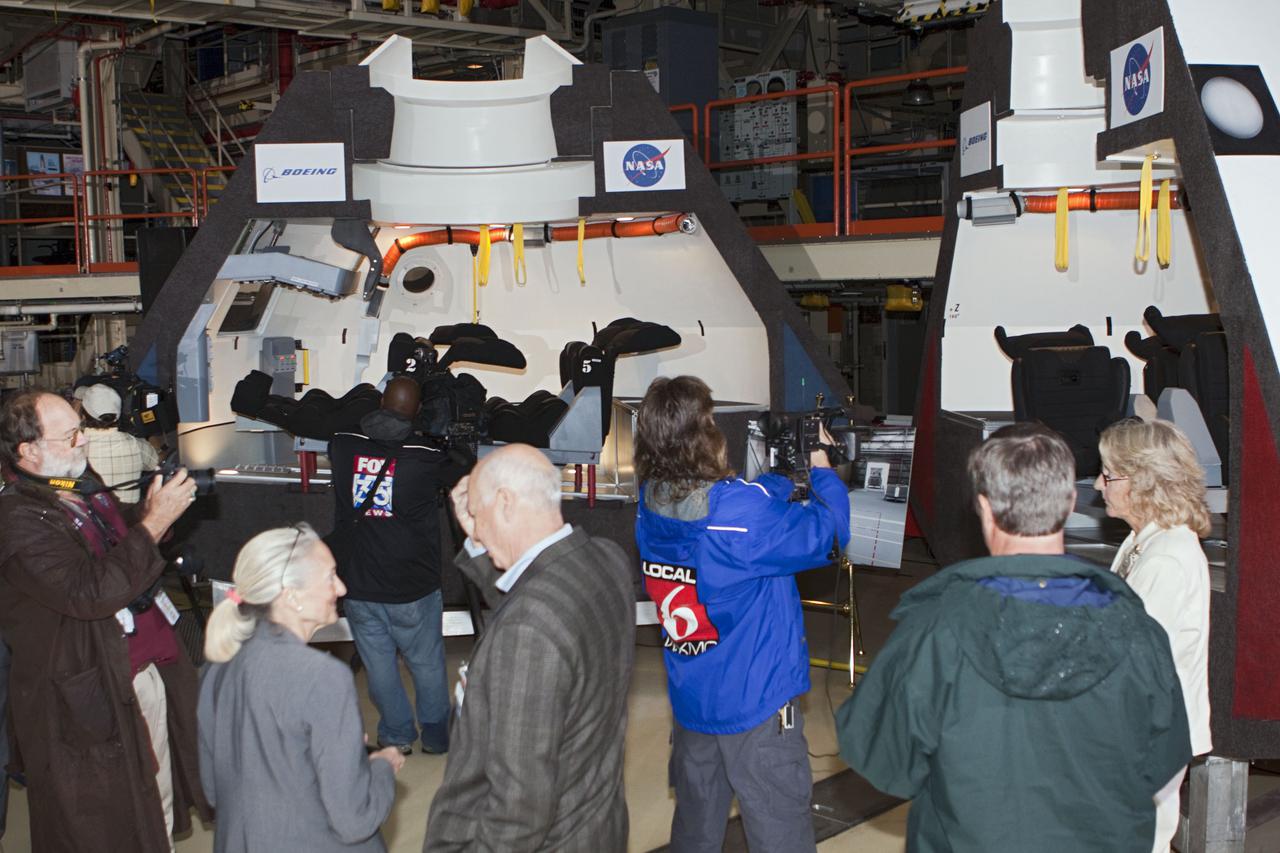 CAPE CANAVERAL, Fla. – In the Orbiter Processing Facility-3 (OPF-3) at NASA’s Kennedy Space Center in Florida, guests and media view a full-scale mockup of The Boeing Company’s CST-100 spacecraft at the ceremony announcing the signing of an innovative agreement between NASA and Space Florida.  NASA announced a partnership with Space Florida to occupy, use and modify Kennedy Space Center's Orbiter Processing Facility-3 (OPF-3), the Space Shuttle Main Engine Processing Facility and Processing Control Center. Space Florida has an agreement for use of the OPF-3 with the Boeing Company to manufacture and test the company's Crew Space Transportation (CST-100) spacecraft. The 15-year use permit deal is the latest step Kennedy is making as the center transitions from a historically government-only launch complex to a multi-user spaceport. For more information, visit http:__www.nasa.gov_exploration_commercial_index.html. Photo credit: NASA_Kim Shiflett