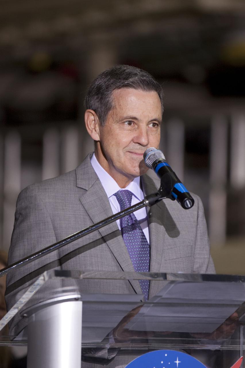 CAPE CANAVERAL, Fla. – In the Orbiter Processing Facility-3 (OPF-3) at NASA’s Kennedy Space Center in Florida, Robert Cabana, Kennedy Space Center director, speaks to the audience during the ceremony announcing the signing of an innovative agreement between NASA and Space Florida.  NASA announced a partnership with Space Florida to occupy, use and modify Kennedy Space Center's Orbiter Processing Facility-3 (OPF-3), the Space Shuttle Main Engine Processing Facility and Processing Control Center. Space Florida has an agreement for use of the OPF-3 with the Boeing Company to manufacture and test the company's Crew Space Transportation (CST-100) spacecraft. The 15-year use permit deal is the latest step Kennedy is making as the center transitions from a historically government-only launch complex to a multi-user spaceport. For more information, visit http:__www.nasa.gov_exploration_commercial_index.html. Photo credit: NASA_Kim Shiflett