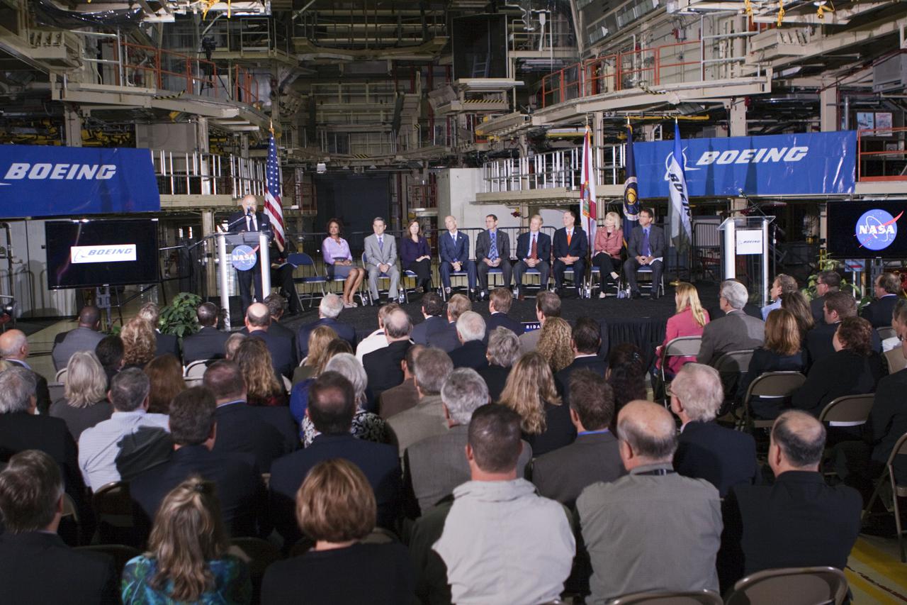 CAPE CANAVERAL, Fla. – In the Orbiter Processing Facility-3 (OPF-3) at NASA’s Kennedy Space Center in Florida, Frank DiBello, president of Space Florida, speaks to the audience after announcing the signing of an innovative agreement between NASA and Space Florida.  From his left are, Florida Lt. Gov. Jennifer Carroll, chairwoman of Space Florida, Robert Cabana, Kennedy Space Center director, Lori Garver, NASA’s deputy administrator, Florida Gov. Rick Scott, John Elbon, vice president and general manager of Boeing's Space Exploration, Sen. Bill Nelson of Florida, Florida Congressman Bill Posey, Florida Representative Sandy Adams, and John Mulholland, vice president and program manager of Boeing's Commercial Crew Programs.  NASA announced a partnership with Space Florida to occupy, use and modify Kennedy Space Center's Orbiter Processing Facility-3 (OPF-3), the Space Shuttle Main Engine Processing Facility and Processing Control Center. Space Florida has an agreement for use of the OPF-3 with the Boeing Company to manufacture and test the company's Crew Space Transportation (CST-100) spacecraft. The 15-year use permit deal is the latest step Kennedy is making as the center transitions from a historically government-only launch complex to a multi-user spaceport. For more information, visit http:__www.nasa.gov_exploration_commercial_index.html. Photo credit: NASA_Kim Shiflett