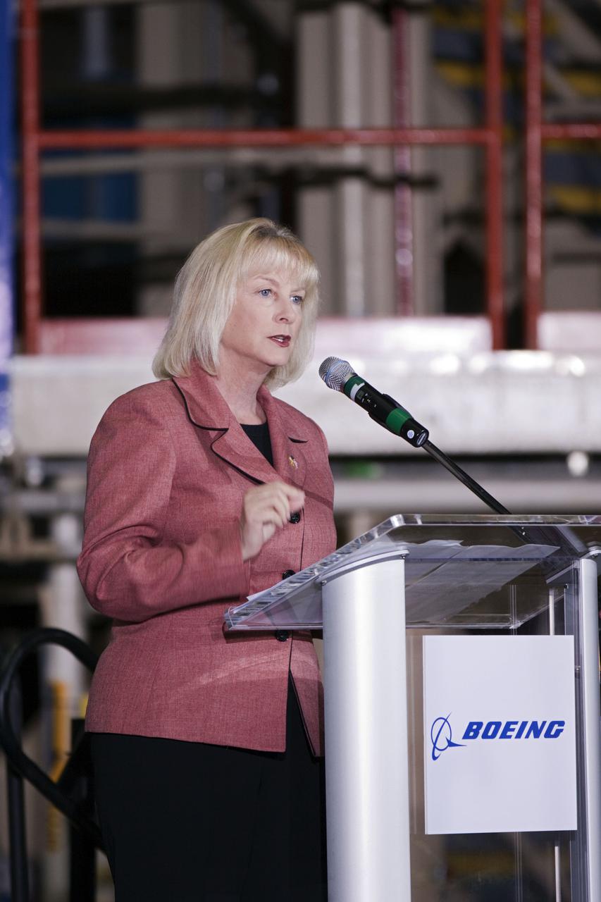 CAPE CANAVERAL, Fla. – In the Orbiter Processing Facility-3 (OPF-3) at NASA’s Kennedy Space Center in Florida, Florida Representative Sandy Adams, speaks to the audience during the ceremony announcing the signing of an innovative agreement between NASA and Space Florida.  NASA announced a partnership with Space Florida to occupy, use and modify Kennedy Space Center's Orbiter Processing Facility-3 (OPF-3), the Space Shuttle Main Engine Processing Facility and Processing Control Center. Space Florida has an agreement for use of the OPF-3 with the Boeing Company to manufacture and test the company's Crew Space Transportation (CST-100) spacecraft. The 15-year use permit deal is the latest step Kennedy is making as the center transitions from a historically government-only launch complex to a multi-user spaceport. For more information, visit http:__www.nasa.gov_exploration_commercial_index.html. Photo credit: NASA_Kim Shiflett
