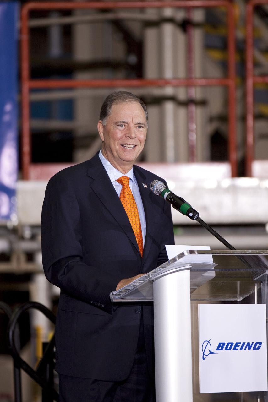 CAPE CANAVERAL, Fla. – In the Orbiter Processing Facility-3 (OPF-3) at NASA’s Kennedy Space Center in Florida, Florida Congressman Bill Posey, speaks to the audience during the ceremony announcing the signing of an innovative agreement between NASA and Space Florida.  NASA announced a partnership with Space Florida to occupy, use and modify Kennedy Space Center's Orbiter Processing Facility-3 (OPF-3), the Space Shuttle Main Engine Processing Facility and Processing Control Center. Space Florida has an agreement for use of the OPF-3 with the Boeing Company to manufacture and test the company's Crew Space Transportation (CST-100) spacecraft. The 15-year use permit deal is the latest step Kennedy is making as the center transitions from a historically government-only launch complex to a multi-user spaceport. For more information, visit http:__www.nasa.gov_exploration_commercial_index.html. Photo credit: NASA_Kim Shiflett
