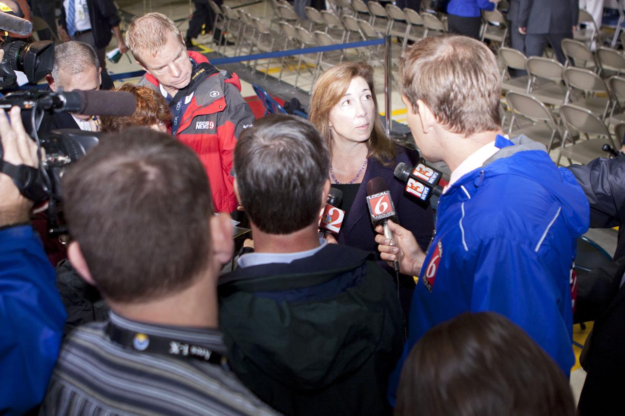 CAPE CANAVERAL, Fla. – In the Orbiter Processing Facility-3 (OPF-3) at NASA’s Kennedy Space Center in Florida, Lori Garver, NASA’s deputy administrator, speaks to the media following the ceremony which announced the signing of an innovative agreement between NASA and Space Florida.  NASA announced a partnership with Space Florida to occupy, use and modify Kennedy Space Center's Orbiter Processing Facility-3 (OPF-3), the Space Shuttle Main Engine Processing Facility and Processing Control Center. Space Florida has an agreement for use of the OPF-3 with the Boeing Company to manufacture and test the company's Crew Space Transportation (CST-100) spacecraft. The 15-year use permit deal is the latest step Kennedy is making as the center transitions from a historically government-only launch complex to a multi-user spaceport. For more information, visit http:__www.nasa.gov_exploration_commercial_index.html. Photo credit: NASA_Kim Shiflett