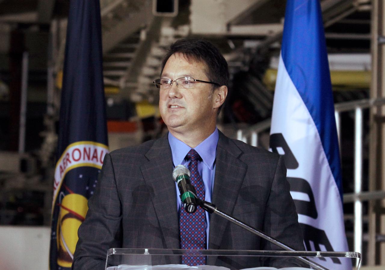 CAPE CANAVERAL, Fla. – In the Orbiter Processing Facility-3 (OPF-3) at NASA’s Kennedy Space Center in Florida, John Mulholland, vice president and program manager of Boeing's Commercial Crew Programs, speaks to the audience after announcing the signing of an innovative agreement between NASA and Space Florida.     NASA announced a partnership with Space Florida to occupy, use and modify Kennedy Space Center's Orbiter Processing Facility-3 (OPF-3), the Space Shuttle Main Engine Processing Facility and Processing Control Center. Space Florida has an agreement for use of the OPF-3 with the Boeing Company to manufacture and test the company's Crew Space Transportation (CST-100) spacecraft. The 15-year use permit deal is the latest step Kennedy is making as the center transitions from a historically government-only launch complex to a multi-user spaceport. For more information, visit http:__www.nasa.gov_exploration_commercial_index.html. Photo credit: NASA_Ken Thornsley