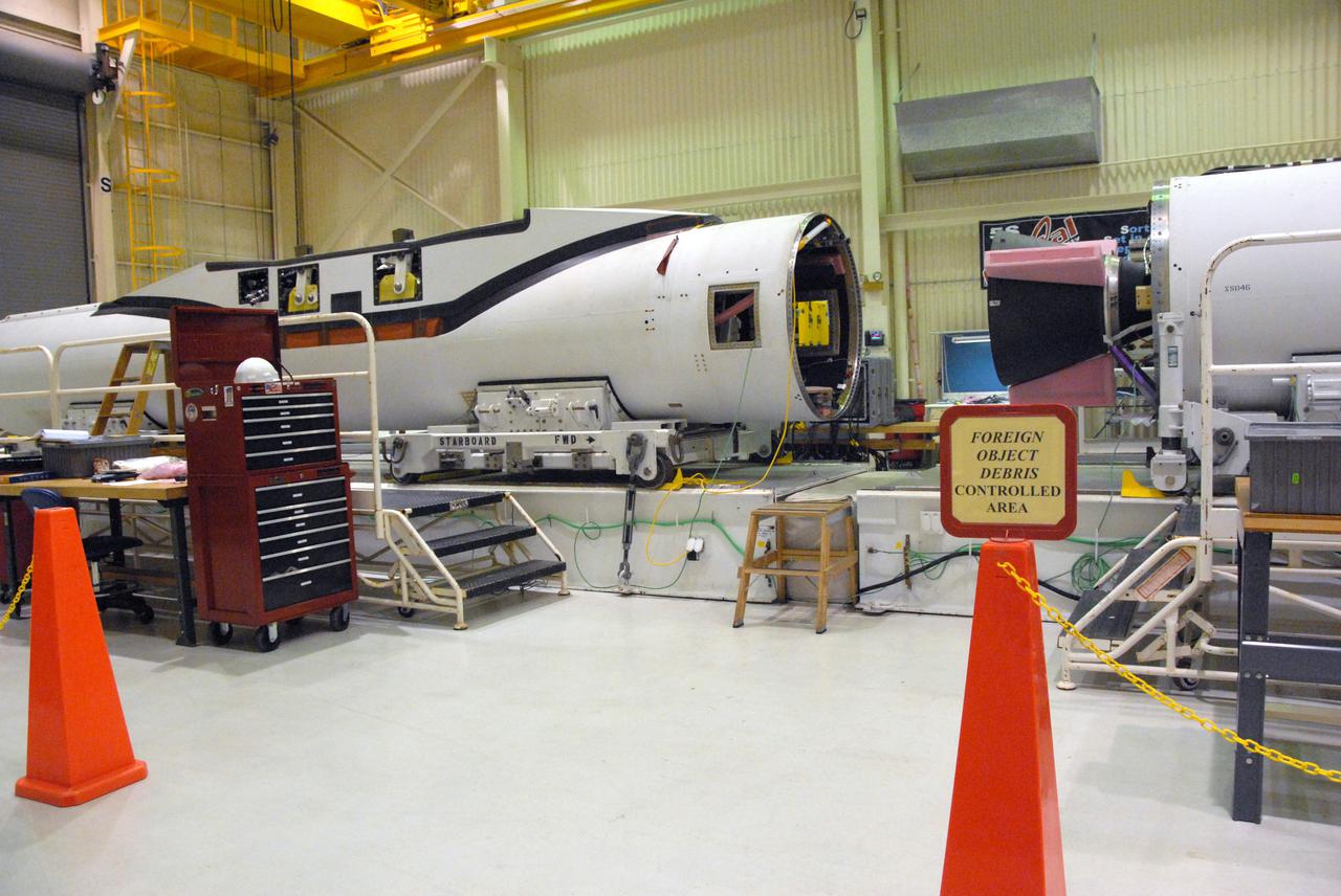 VANDENBERG AIR FORCE BASE, Calif. -- In a processing facility at Vandenberg Air Force Base in California, the three stages of the Pegasus XL launch vehicle are seen immediately prior to installation of the vehicle’s wing. The Orbital Sciences Corp. Pegasus rocket will launch the Nuclear Spectroscopic Telescope Array (NuSTAR) into space.  After the rocket and spacecraft are processed at Vandenberg, they will be flown on the Orbital Sciences’ L-1011 carrier aircraft to the Ronald Reagan Ballistic Missile Defense Test Site at the Pacific Ocean’s Kwajalein Atoll for launch. The high-energy x-ray telescope will conduct a census for black holes, map radioactive material in young supernovae remnants, and study the origins of cosmic rays and the extreme physics around collapsed stars. For more information, visit science.nasa.gov_missions_nustar_.  Photo credit: NASA_Randy Beaudoin, VAFB