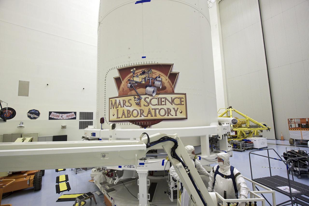 CAPE CANAVERAL, Fla. -- In the Payload Hazardous Servicing Facility at NASA's Kennedy Space Center in Florida, the Mars Science Laboratory (MSL) logo -- depicting the mission's compact car-sized rover, Curiosity -- has been applied to the exterior of an Atlas V rocket's payload fairing. Tucked inside the fairing is the MSL spacecraft, including Curiosity, which has 10 science instruments designed to search for evidence on whether Mars has had environments favorable to microbial life, including the chemical ingredients for life. The unique rover will use a laser to look inside rocks and release its gasses so that the rover’s spectrometer can analyze and send the data back to Earth. Launch of MSL aboard a United Launch Alliance Atlas V rocket is planned for Nov. 25 from Space Launch Complex-41 on Cape Canaveral Air Force Station. For more information, visit http:__www.nasa.gov_msl. Photo credit: NASA_Jim Grossmann