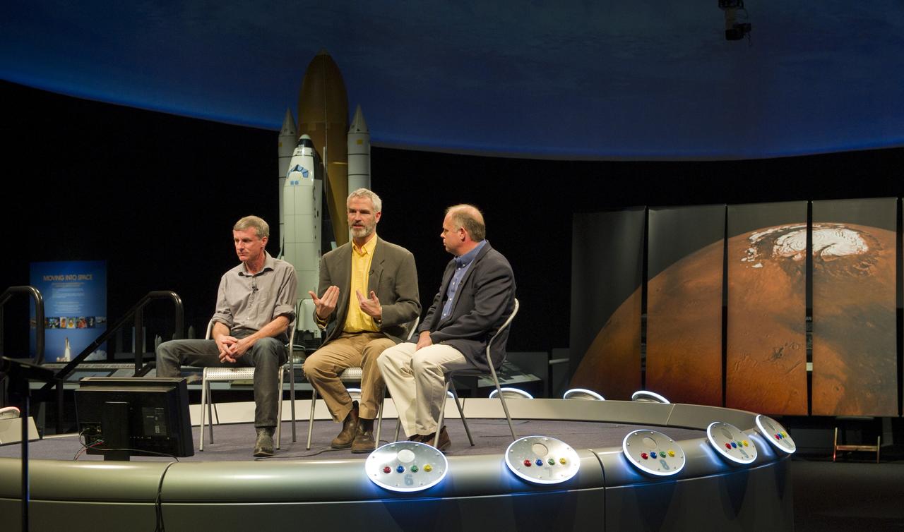 Dr. John Grant, seated right, moderates a discussion with Dr. Jack Mustard, from Brown University, and Dr. Steve Squyres, from Cornell University, seated left, during a Mars Program Update, Thursday, Jan. 13, 2011, at the Smithsonian National Air and Space Museum in Washington. Prominent scientists discussed evidence of water on Mars, current Program status, including the 7th Anniversary of the Mars rovers and the upcoming Mars Science Laboratory mission and previewed exciting discoveries to come. Photo Credit: (NASA/Paul E. Alers)