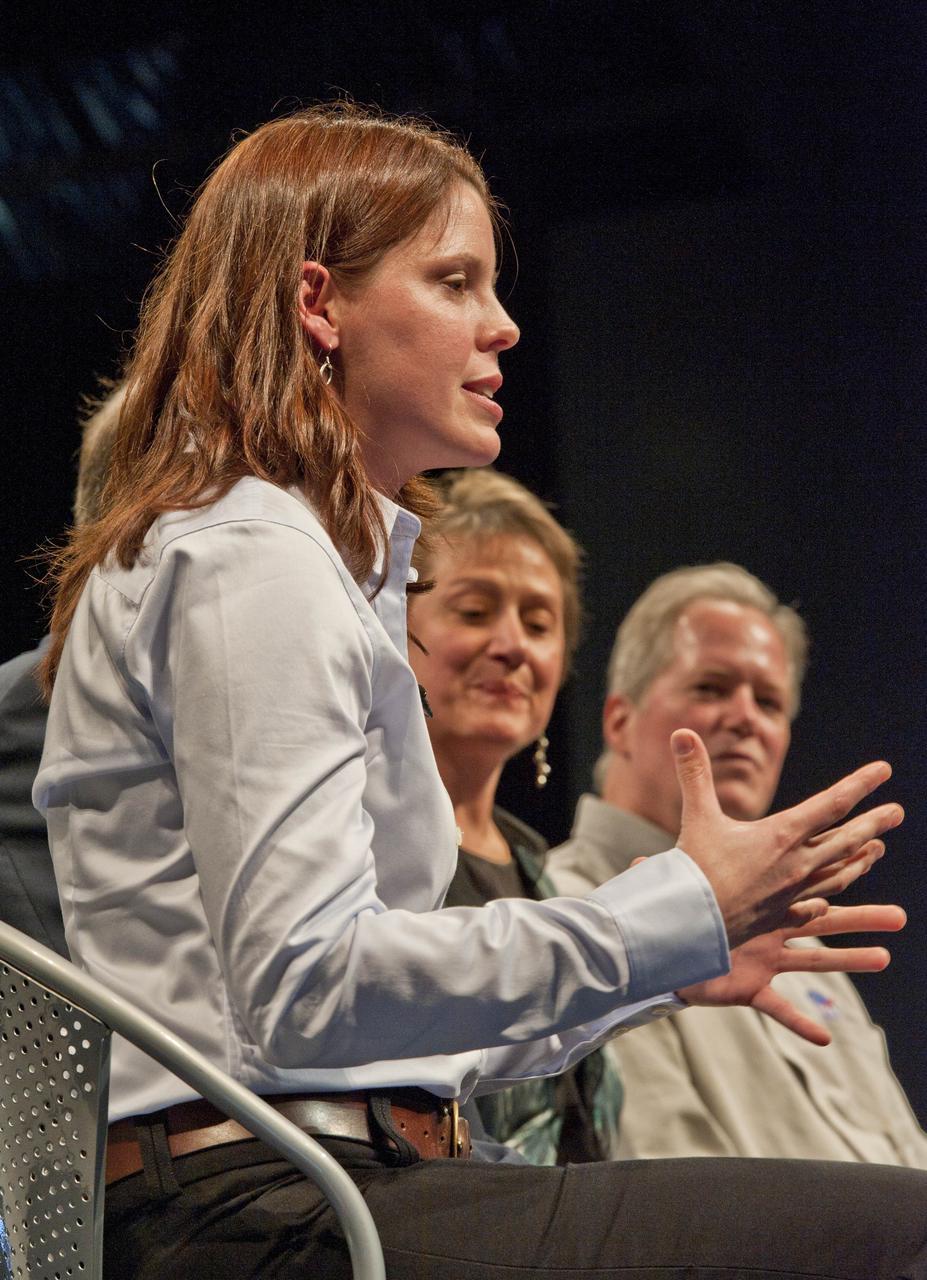 Dr. Jennifer Elgenbrode, from Goddard Space Flight Center, foreground, talks as Dr. Mary Voytek and Dr. Michael Meyer, far right, look on during a Mars Program Update where prominent scientists discussed evidence of water on Mars, current Program status, including the 7th Anniversary of the Mars rovers and the upcoming Mars Science Laboratory mission and previewing exciting discoveries to come, Thursday, Jan. 13, 2011, at the Smithsonian National Air and Space Museum in Washington.  Photo Credit: (NASA/Paul E. Alers)