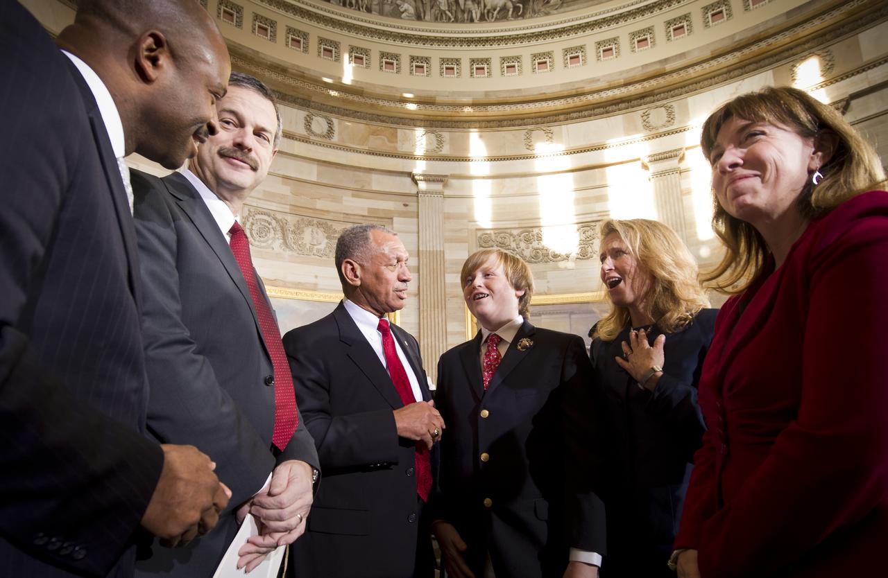 NASA Administrator Charles Bolden. 3rd from left, introduces Edward Moore Kennedy III, 4th from left, to NASA Astronaut Leland Melvin, left, and former NASA Astronaut Scott Altman, 2nd from left, as Edward's mother Kiki Kennedy, wife of Edward M Kennedy Jr. and NASA Deputy Administrator Lori Garver, right, look on at an event recognizing the 50th anniversary of the inauguration of John F. Kennedy as president of the United States, Thursday, Jan. 20, 2001 at the U.S. Capitol rotunda. Photo Credit: (NASA/Bill Ingalls)