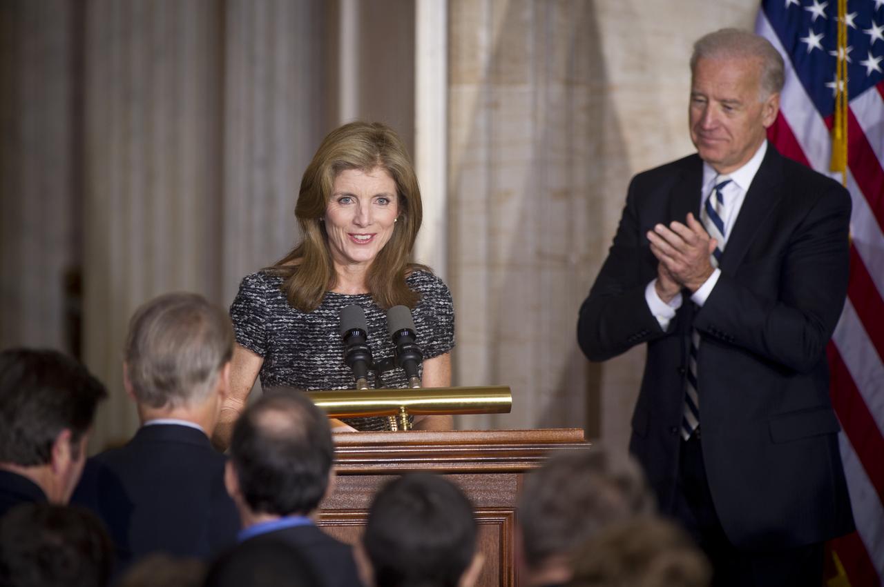 Caroline Kennedy is welcomed the podium by U.S. Vice President Joe Biden and other dignitaries before speaking at an event recognizing the 50th anniversary of the inauguration of John F. Kennedy as President of the United States, Thursday, Jan. 20, 2011 in the rotunda at the U.S. Capitol.  Photo Credit: (NASA/Bill Ingalls)