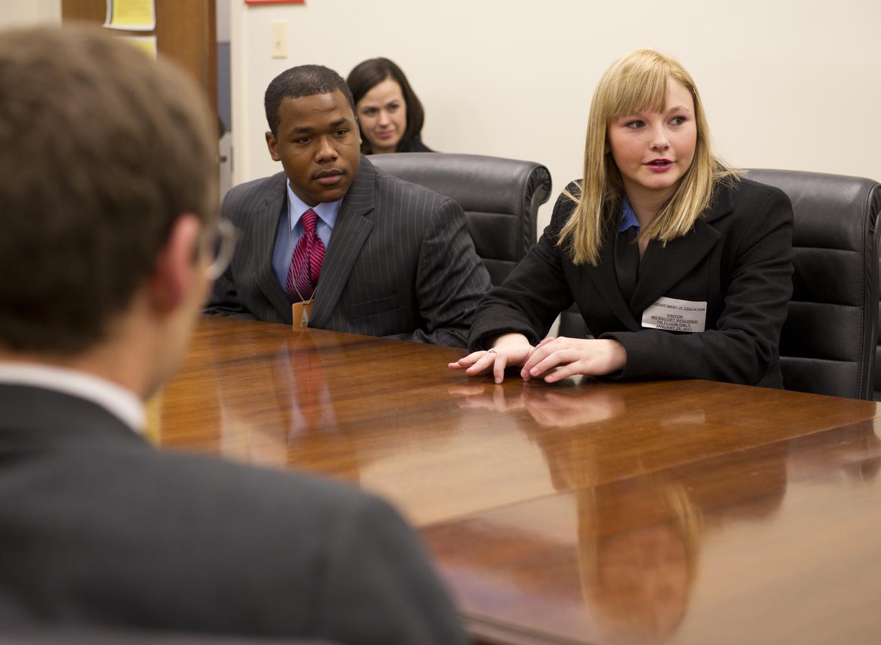 White House Office of Science and Technology Policy Associate Director for Science Carl Wieman, left, talks with West Philadelphia High School student Brandon Ford, left, and Montana Central Catholic High School student Mikayla Nelson at the New Executive Office Building, Tuesday, Jan. 25, 2011 in Washington. The students are all young achievers in science and technology and will be amongst other guests seated in the First Lady’s Box in the U.S. Capitol during the President’s State of the Union Address.  Photo Credit: (NASA/Bill Ingalls)