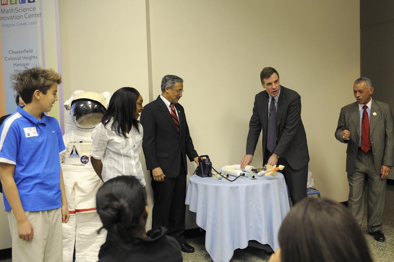 NASA Administrator Charles Bolden, right, counts down along with others as U.S. Sen. Mark Warner, D-Va., readies to launch a paper rocket as U.S. Rep. Bobby Scott, D-Va., third right, looks on, Friday, Jan. 28, 2011, at the MathScience Innovation Center in Richmond, Va. Earlier, Bolden, spoke to students from Albert Hill Middle School where he highlighted the importance of science, technology, engineering and math, or STEM, as he shared his life experiences with the students. (Photo Credit:NASA/Paul E. Alers)
