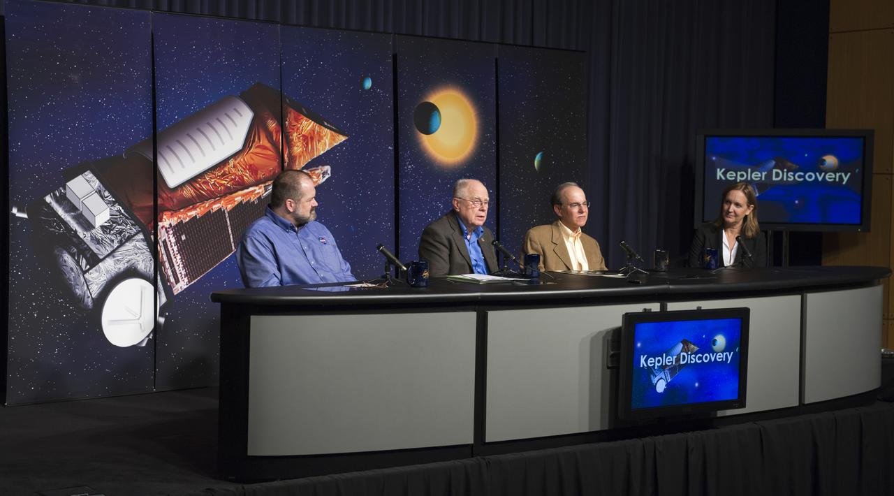 William Borucki, Kepler Science Principal Investigator from NASA's Ames Research Center, second from left, speaks during a news conference, Wednesday, Feb. 2, 2010, at NASA Headquarters in Washington as Douglas Hudgins, left, Jack Lissauer and Debra Fischer, far right, look on. Scientists using NASA's Kepler, a space telescope, recently discovered six planets made of a mix of rock and gases orbiting a single sun-like star, known as Kepler-11, which is located approximately 2,000 light years from Earth. Photo Credit: (NASA/Paul E. Alers)