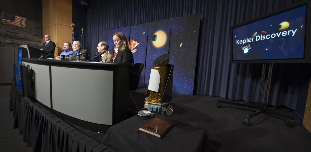 William Borucki, Kepler Science Principal Investigator from NASA's Ames Research Center, second from left, speaks during a news conference, Wednesday, Feb. 2, 2010, at NASA Headquarters in Washington as Douglas Hudgins, left, Jack Lissauer and Debra Fischer, far right, look on. Scientists using NASA's Kepler, a space telescope, recently discovered six planets made of a mix of rock and gases orbiting a single sun-like star, known as Kepler-11, which is located approximately 2,000 light years from Earth. Photo Credit: (NASA/Paul E. Alers)