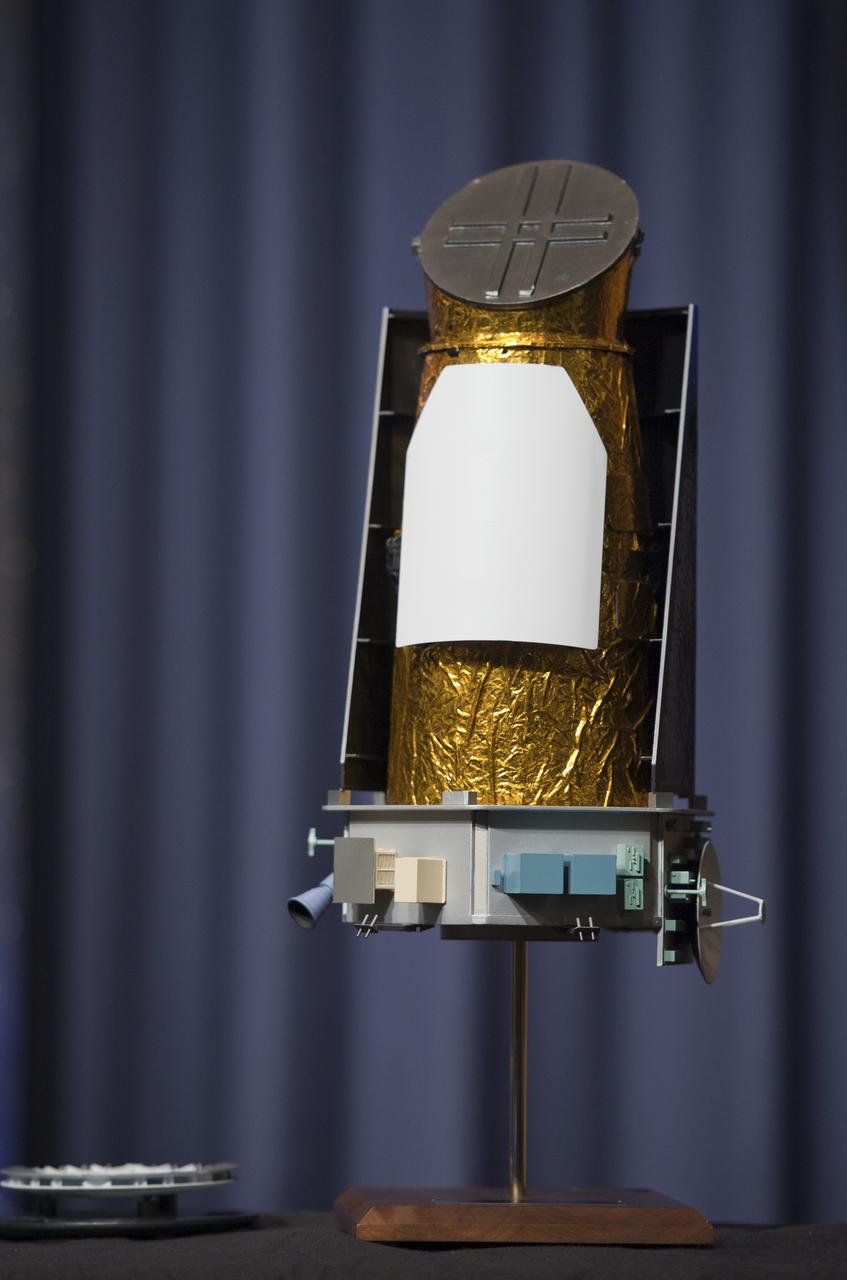 A scale model of the Kepler space telescope is seen at a news conference, Wednesday, Feb. 2, 2010, at NASA Headquarters in Washington. Scientists using NASA's Kepler, a space telescope, recently discovered six planets made of a mix of rock and gases orbiting a single sun-like star, known as Kepler-11, which is located approximately 2,000 light years from Earth. Photo Credit: (NASA/Paul E. Alers)