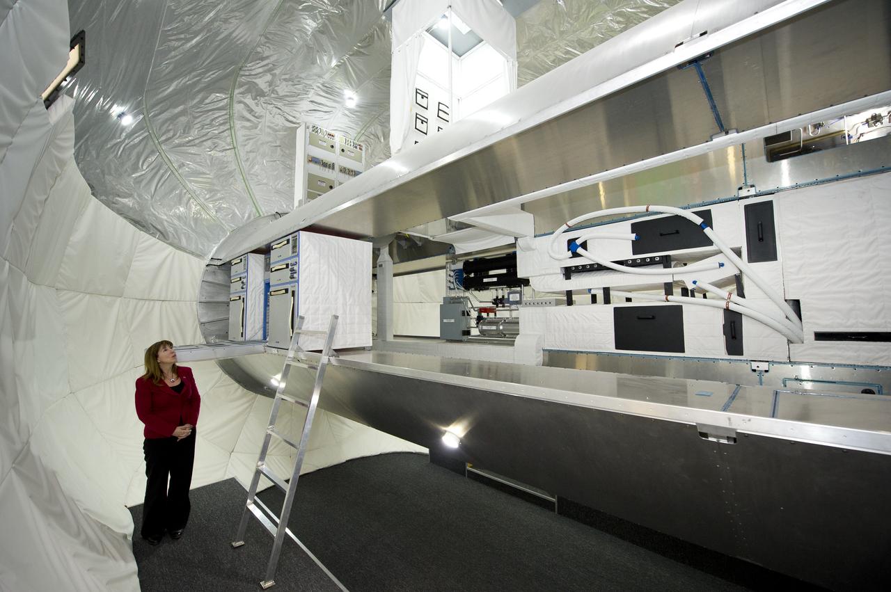 NASA Deputy Administrator Lori Garver views the inside of a full scale mockup of Bigelow Aerospace's Space Station Alpha during a tour of the Bigelow Aerospace facilities by the company's President Robert Bigelow on Friday, Feb. 4, 2011, in Las Vegas.  NASA has been discussing potential partnership opportunities with Bigelow for its inflatable habitat technologies as part of NASA's goal to develop innovative technologies to ensure that the U.S. remains competitive in future space endeavors. Photo Credit: (NASA/Bill Ingalls)