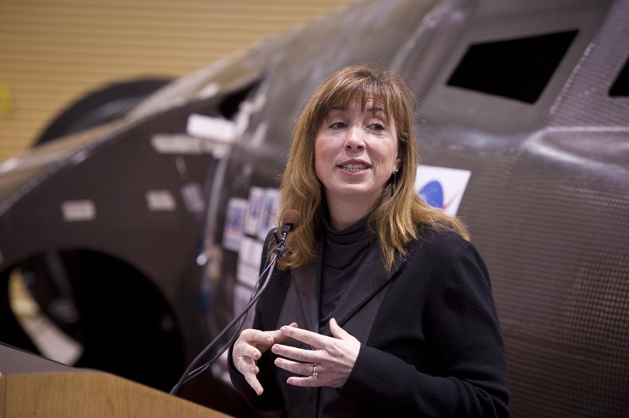 NASA Deputy Administrator Lori Garver talks during a press conference with Sierra Nevada's Dream Chaser spacecraft in the background on Saturday, Feb. 5, 2011, at the University of Colorado at Boulder.  Sierra Nevada's Dream Chaser spacecraft is under development with support from NASA's Commercial Crew Development Program to provide crew transportation to and from low Earth orbit.  NASA is helping private companies develop innovative technologies to ensure that the U.S. remains competitive in future space endeavors. Photo Credit: (NASA/Bill Ingalls)