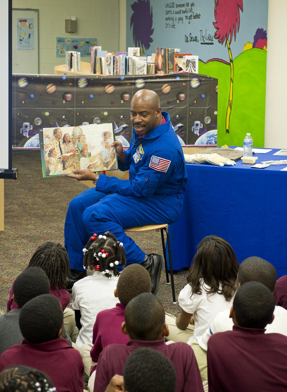 Leland Melvin, NASA Associate Administrator for Education and former space shuttle astronaut, reads to first and third grade students from the book “The Moon Over Star” at Ferebee-Hope Elementary School on Tuesday, Feb. 8, 2011, in Washington, DC. Ferebee-Hope Elementary School, in collaboration with Reading is Fundamental (RIF), hosted this event in honor of Black History Month, and to highlight the importance of reading. Reading is Fundamental distributes more than 50,000 free books to help children discover the joy of reading.  Photo Credit: (NASA/Carla Cioffi) 