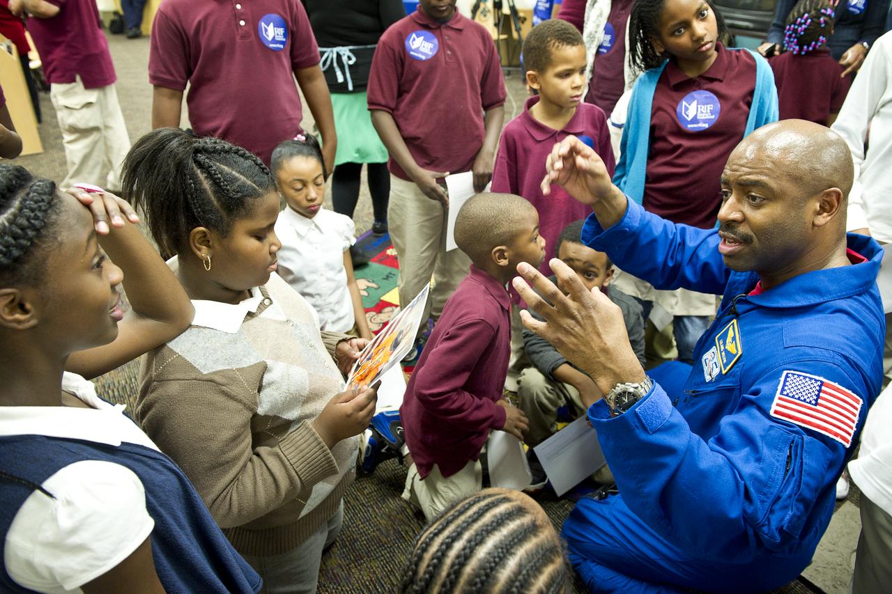 Leland Melvin, NASA Associate Administrator for Education and former space shuttle astronaut, far right, answers questions from students about his experience as an astronaut on Tuesday, Feb. 8, 2011, at Ferebee-Hope Elementary School in Washington, DC.  Ferebee-Hope Elementary School, in collaboration with Reading is Fundamental (RIF), hosted this event in honor of Black History Month, and to highlight the importance of reading. Photo Credit: (NASA/Carla Cioffi) 