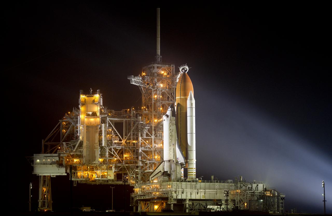 The space shuttle Discovery is seen shortly after the Rotating Service Structure was rolled back at launch pad 39A, at the Kennedy Space Center in Cape Canaveral, Florida, on Wednesday, Feb. 23, 2011. Discovery, on its 39th and final flight, will carry the Italian-built Permanent Multipurpose Module (PMM), Express Logistics Carrier 4 (ELC4) and Robonaut 2, the first humanoid robot in space to the International Space Station. Photo Credit: (NASA/Bill Ingalls)