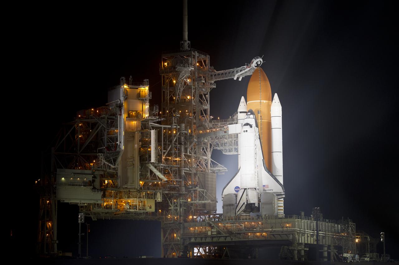 The space shuttle Discovery is seen shortly after the Rotating Service Structure was rolled back at launch pad 39A, at the Kennedy Space Center in Cape Canaveral, Florida, on Wednesday, Feb. 23, 2011. Discovery, on its 39th and final flight, will carry the Italian-built Permanent Multipurpose Module (PMM), Express Logistics Carrier 4 (ELC4) and Robonaut 2, the first humanoid robot in space to the International Space Station. Photo Credit: (NASA/Bill Ingalls)