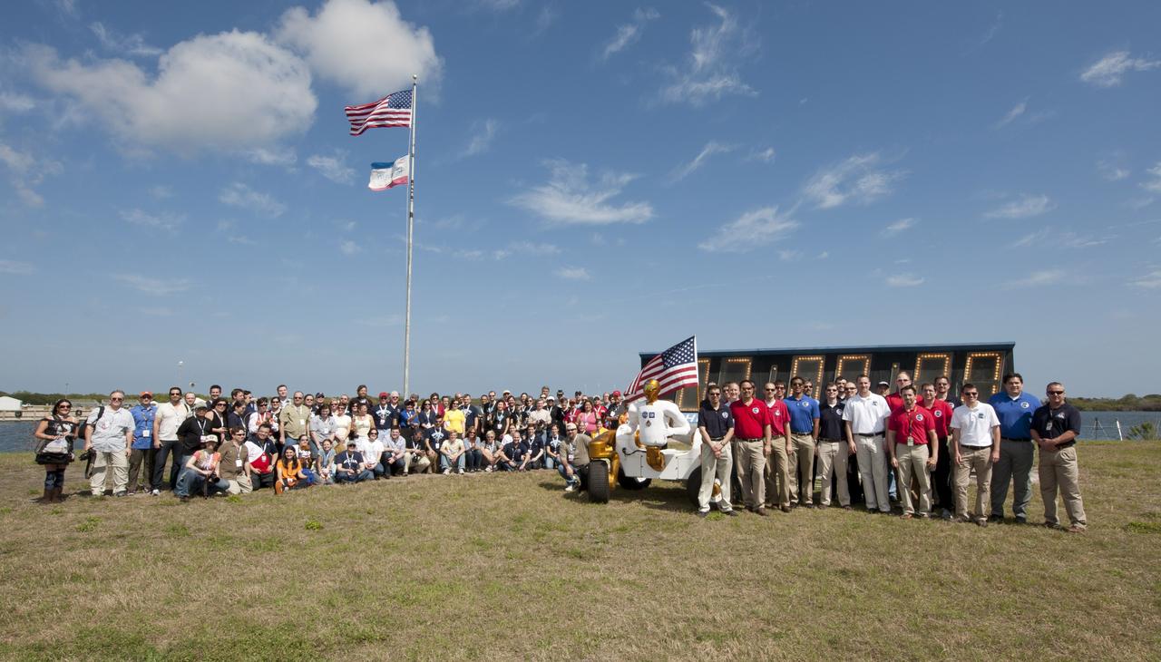 NASA Tweetup participants along with NASA engineers and Robonaut 2 stand at the launch clock, Thursday, Feb. 24, 2011, prior to the launch of the space shuttle Discovery (STS-133) at Kennedy Space Center in Cape Canaveral, Fla. During the 11-day mission, Discovery will deliver the Italian-built Permanent Multipurpose Module (PMM) and Express Logistics Carrier 4 (ELC4) along with another Robonaut 2, which will become the first humanoid robot in space. Discovery, on its 39th and final flight, is NASA's most flown shuttle. Photo Credit: (NASA/Paul E. Alers)