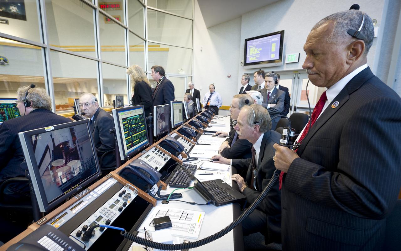 NASA Administrator Charles Bolden and other NASA management watch the launch of space shuttle Discovery (STS-133) from the firing room at Kennedy Space Center, Thursday, Feb. 24, 2011, in Cape Canaveral, Fla. Discovery, on its 39th and final flight, is carrying the Italian-built Permanent Multipurpose Module (PMM), Express Logistics Carrier 4 (ELC4) and Robonaut 2, the first humanoid robot in space to the International Space Station. Photo Credit: (NASA/Bill Ingalls)